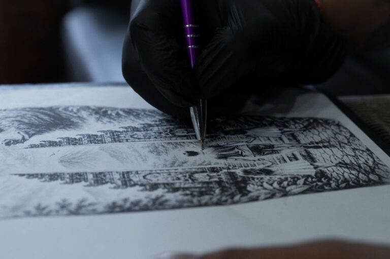 Close-up of an artist developing a custom tattoo sketch